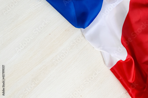 Fototapeta Naklejka Na Ścianę i Meble -  Flag of France on a white background. Happy Bastille Day. 14th July. Celebrating a public holiday. Independence Day. Greeting card or banner. Top view. Layout