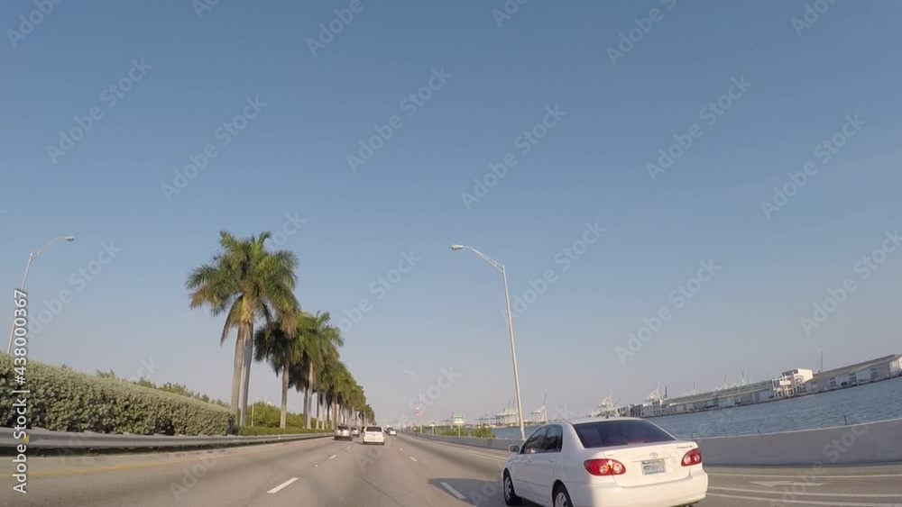 Driving on a highway with lots of palm trees on the side, Miami, high speed Driving on a highway with lots of palm trees on the side, Miami, high speed