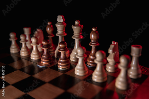 Fotografie, Tablou Chess game on a black background