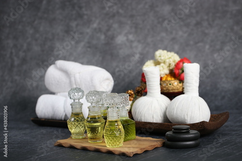 Thai massage with accesories for Asian spa with aroma herb and essential oil for skin. Hot compress ball for body and face care. photo