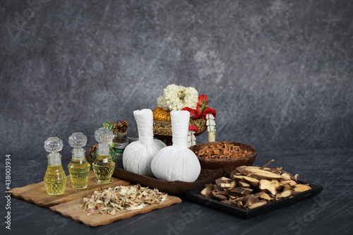Thai massage with accesories for Asian spa with aroma herb and essential oil for skin. Hot compress ball for body and face care.