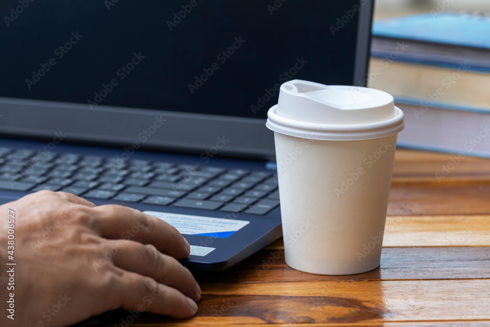 Students drink coffee from white disposable cup.