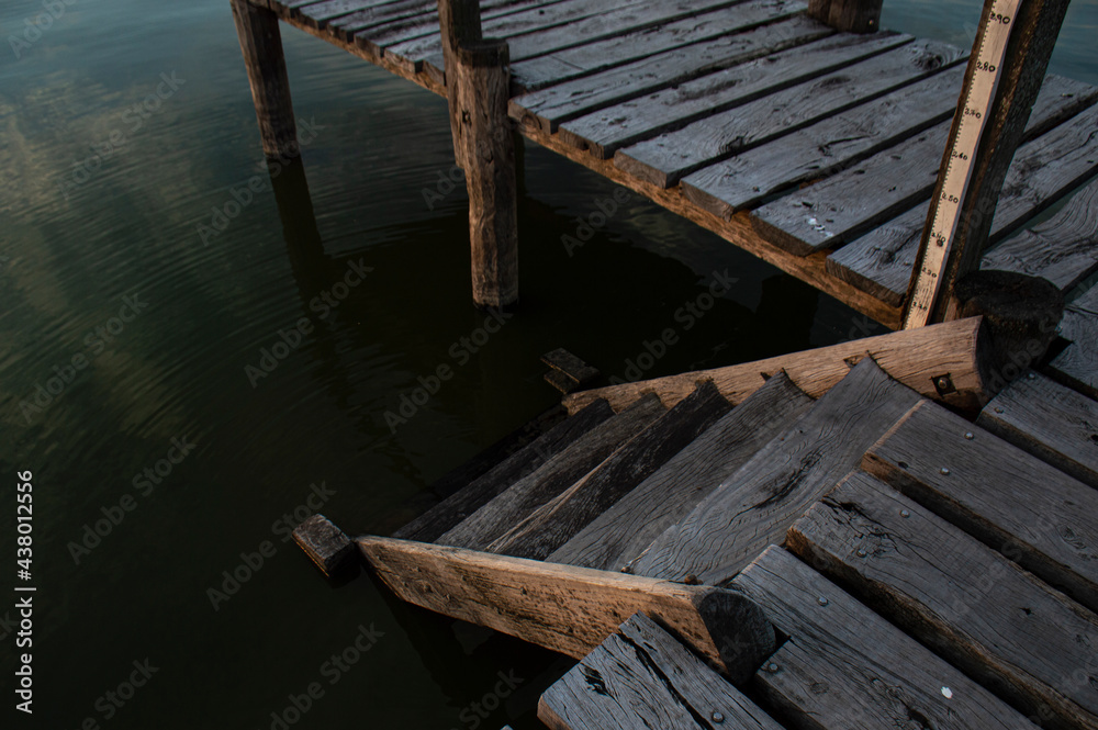 Jetty with wooden stairs leading to a lake
