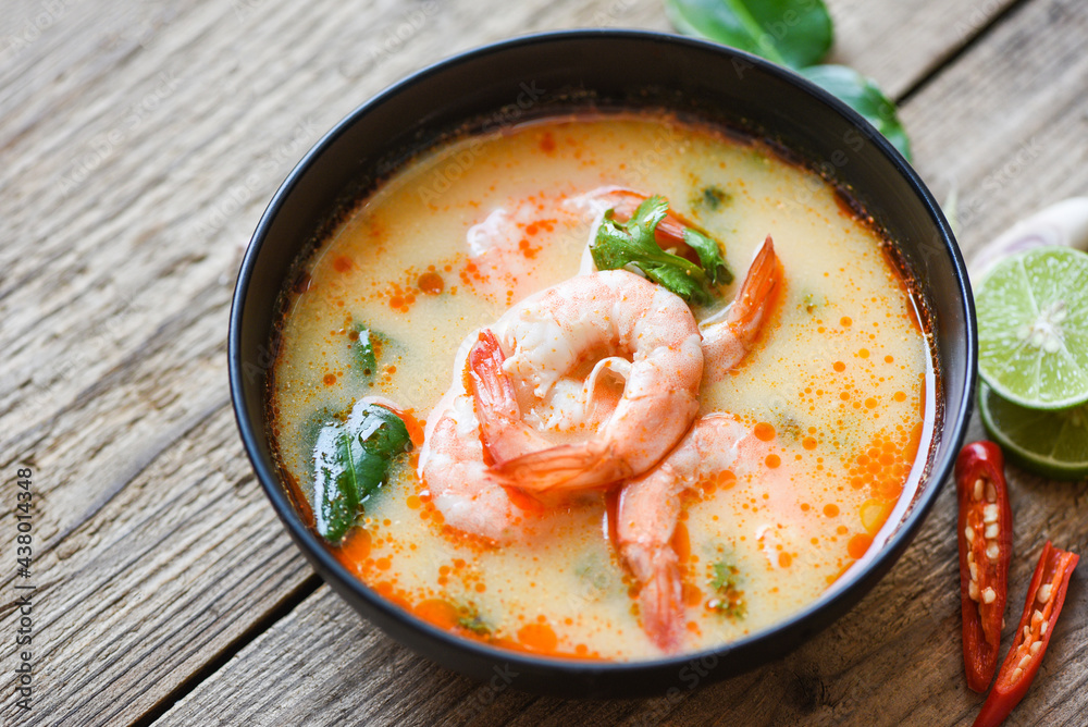 Traditional thai cuisine hot spicy soup shrimp curry with herb and spices Thai food, Shrimp soup bowl, seafood soup with shrimps prawns in the restaurant