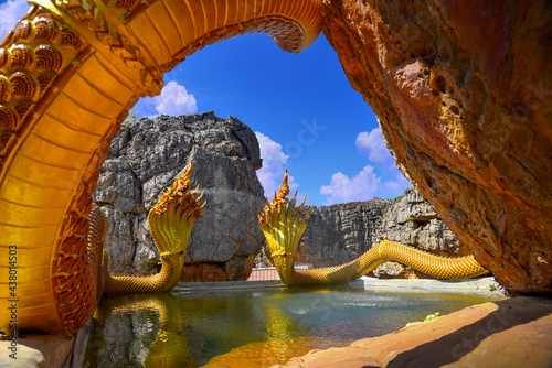 Twin Stucco painted as a large serpent on the mountains at Wat Phu Taphao Thong temple Udon thani province Thailand. Most famous temple. photo