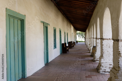 Typical exterior corridor of an old Spanish Mission in California photo