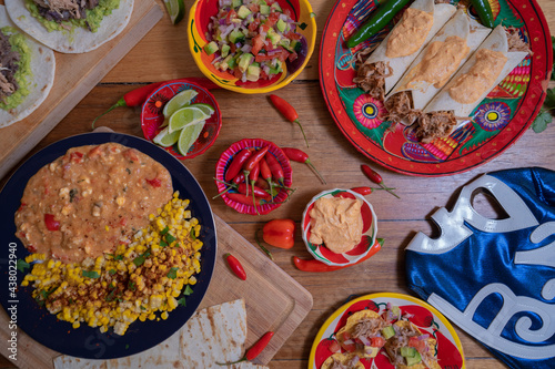 Mexican top down lay flat table with queso, corn, lime, chili Mexican wrestling mask