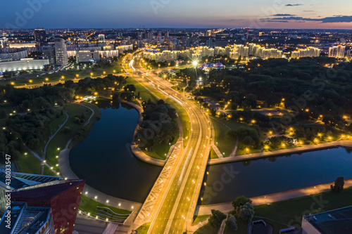 Minsk city at sunset. aerial panoramic view at night with city lights. drone photo.