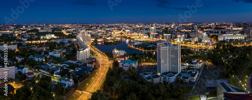 buildings and streets illuminated at night in Minsk downtown. city skyline panorama at night.