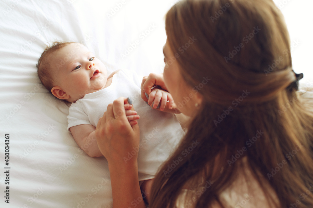Portrait of a beautiful mother, with her nursing baby. High quality photo. Portrait of a beautiful mother, with her nursing baby. High quality photo.