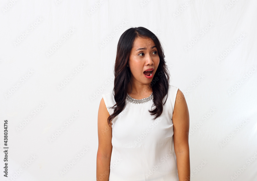 Portrait of Asian woman in surprised and amazed expression. Isolated on white background Portrait of Asian woman in surprised and amazed expression. Isolated on white background