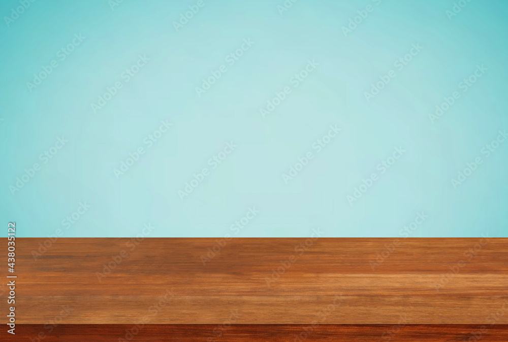 Empty brown wood table top on blue background Empty brown wood table top on blue background