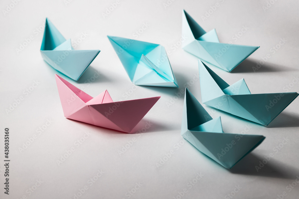 The organizational leadership concept uses a pink paper boat that represents leadership in a team or unit.
The organizational leadership concept uses a pink paper boat that represents leadership in a team or unit.