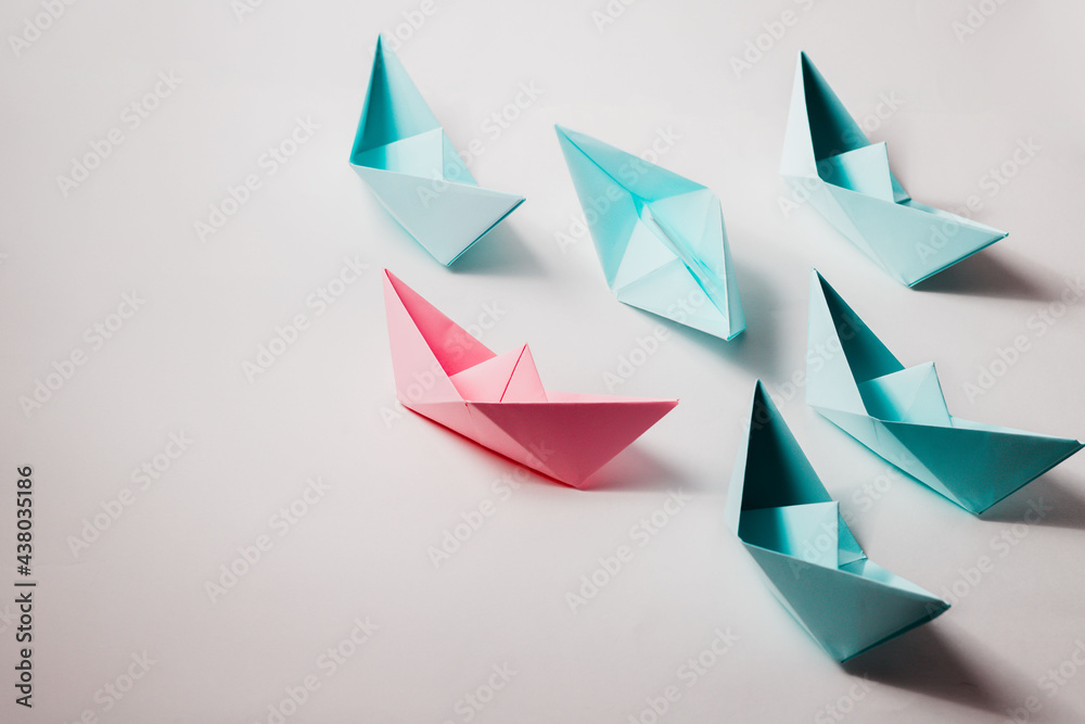 The organizational leadership concept uses a pink paper boat that represents leadership in a team or unit.
The organizational leadership concept uses a pink paper boat that represents leadership in a team or unit.