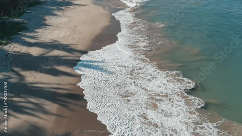 Aerial flying over Sorsogon beach revealing entire coastline. Surfcamp. Philippines photo