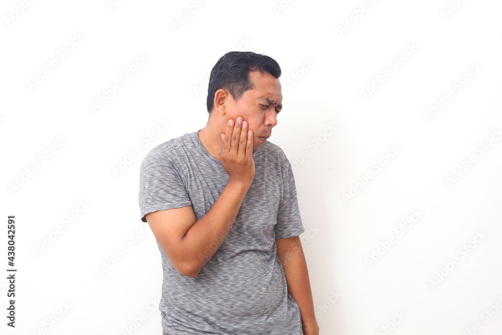 Asian man feeling pain from toothache. Dental concept. Isolated on white background with copyspace.
