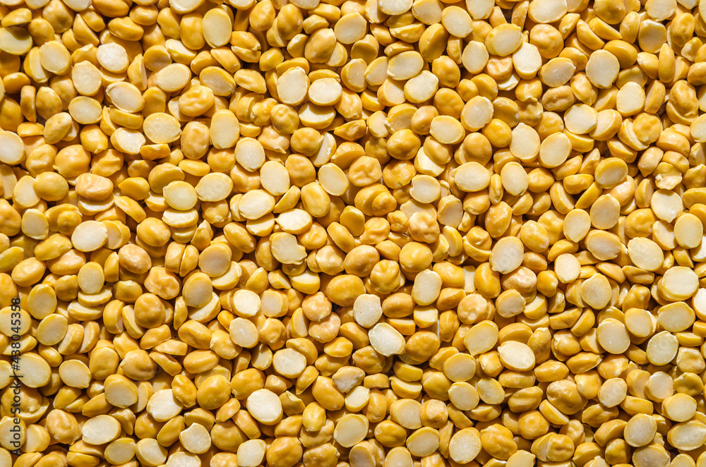 Yellow split chickpeas background texture. Yellow split chickpeas background texture.