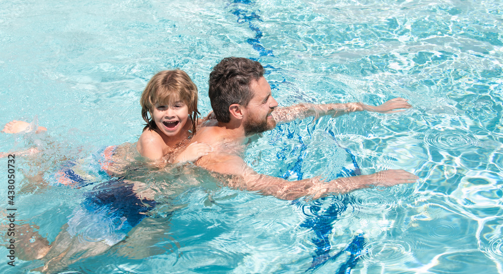 Father and son swimming in pool, summer family. Swimming lessons. Summer vacation. Father and son leisure. Fathers Day.