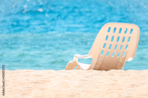 Sun chair on sandy beach. Beautiful beach. Chair on the sandy beach near the sea. Summer holiday and vacation concept for tourism. Inspirational tropical landscape. copy space