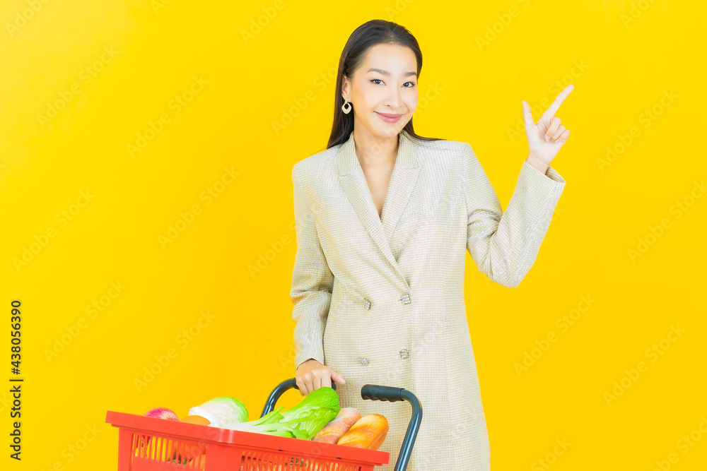 Portrait beautiful young asian woman smile with grocery basket Portrait beautiful young asian woman smile with grocery basket