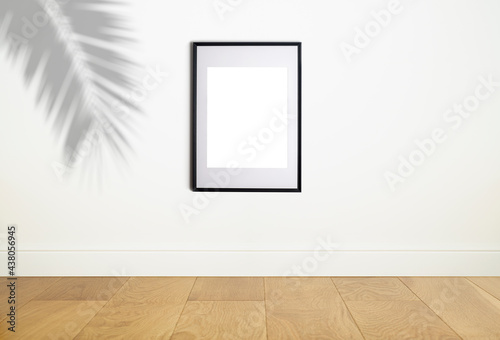 Mock up poster frame in interior white wall. White frame for poster or photo image on clean wall in home room or office interior