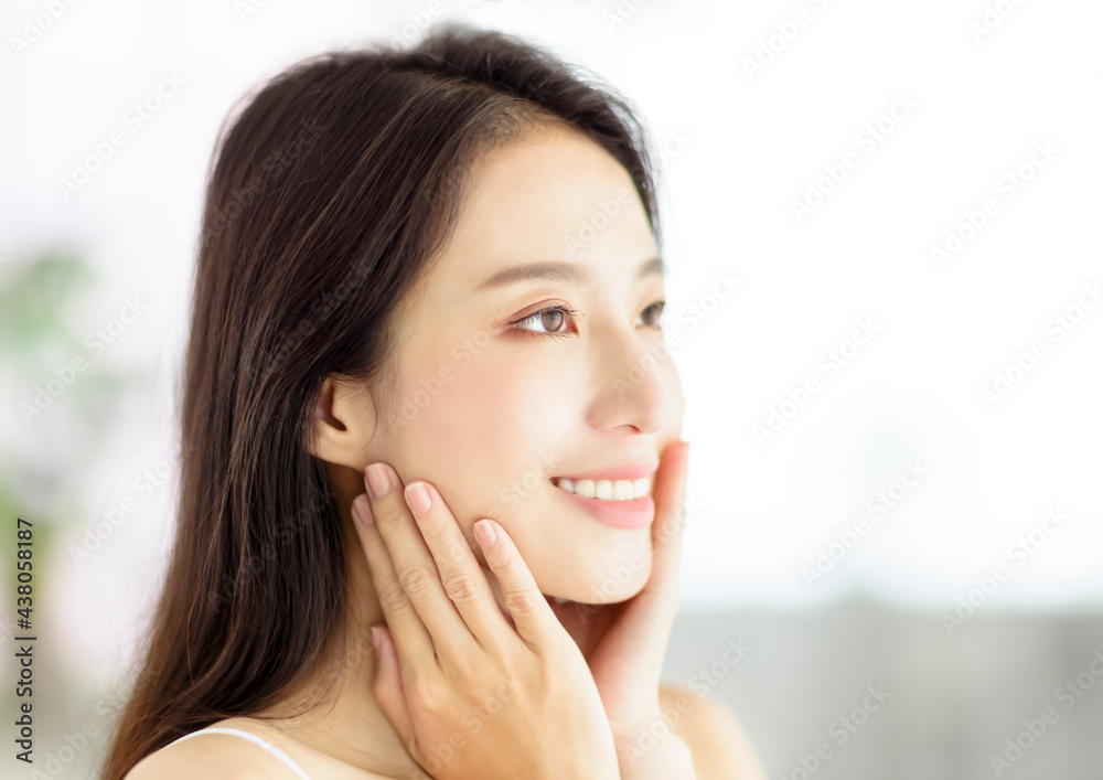 Smiling beautiful pretty asian woman with clean fresh healthy skin Smiling beautiful pretty asian woman with clean fresh healthy skin