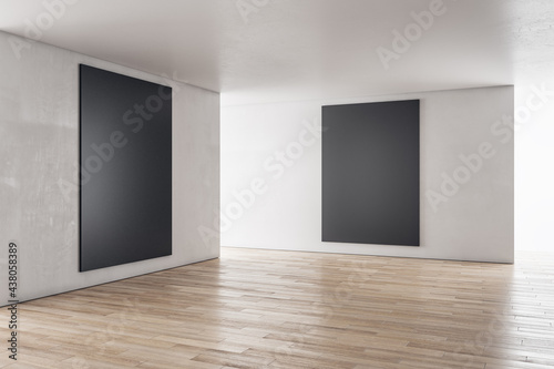 Fototapeta Naklejka Na Ścianę i Meble -  Modern concrete interior with sunlight and empty black frame mockup place. Exhibition, art and advertisement concept. 3D Rendering.