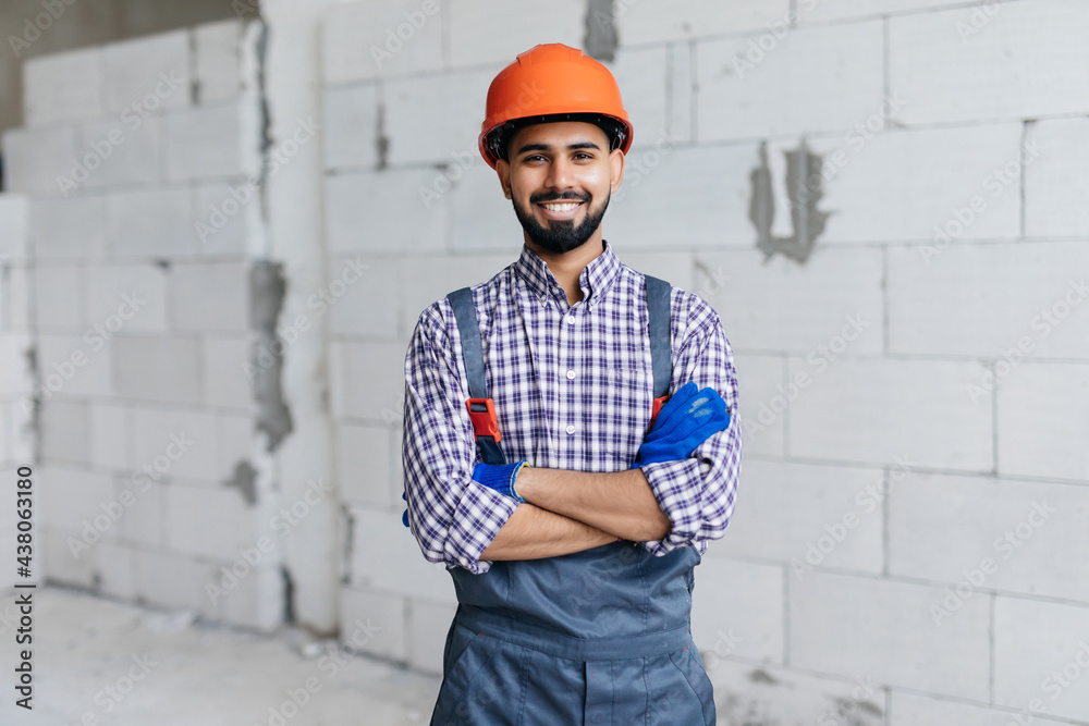 Worker reassure in construction site, Concept proposes to use autoclaved aerated bricks in construction of houses. Worker reassure in construction site, Concept proposes to use autoclaved aerated bricks in construction of houses.