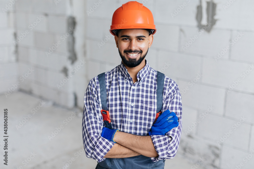 Young worker reassure holds autoclaved aerated bricks in construction site, Concept proposes to use autoclaved aerated bricks in construction of houses.