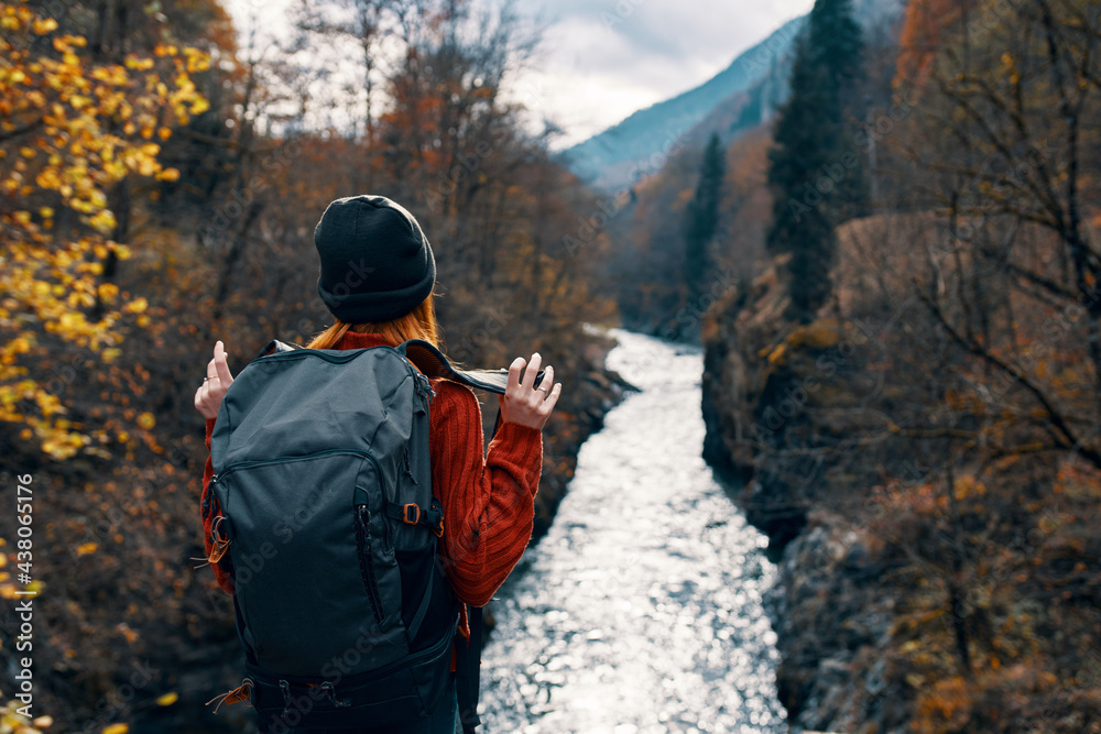 woman hiker with backpack in the mountains autumn forest woman hiker with backpack in the mountains autumn forest