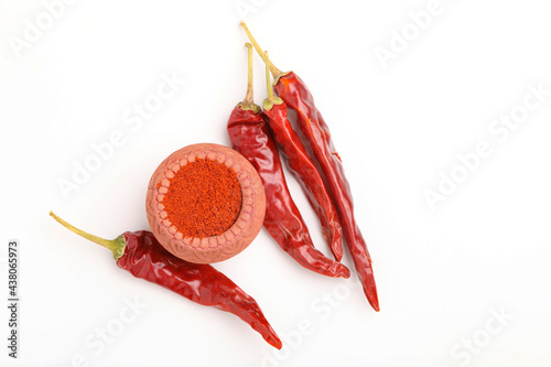 Red chilli powder in a bowl with dry red chilli photo