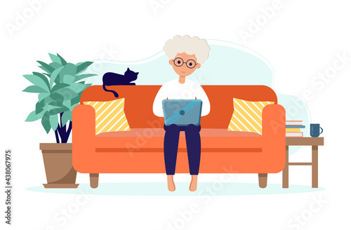 Senior woman stay at home. Old woman sitting on sofa with laptop. Pensioner with a cat. Elderly people during the coronavirus outbreak. Vector illustration in a flat style.