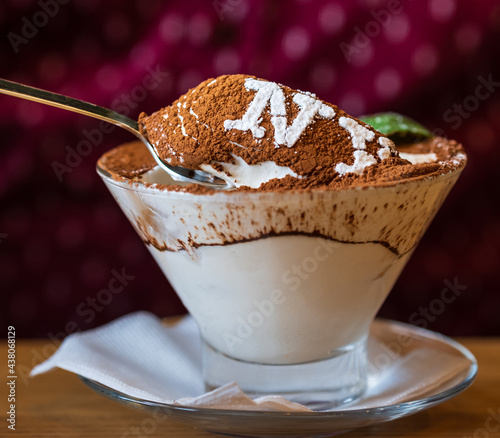 Classic tiramisu in a glass. Tiramisu with the inscription: 'I love NY'. Tiramisu - traditional italian dessert from mascarpone cheese and biscuit  photo