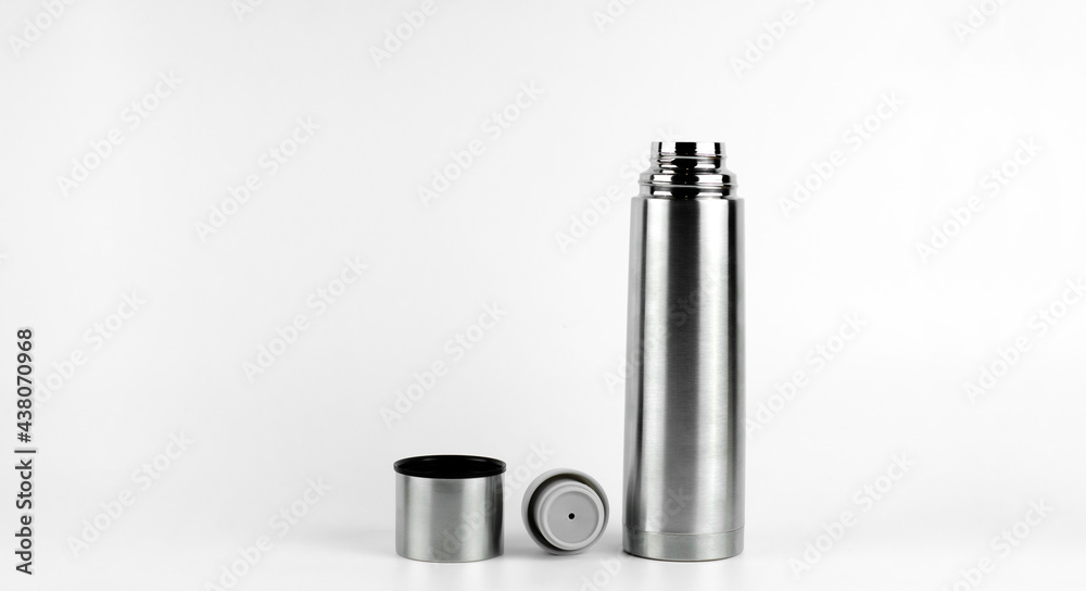 Metal thermos made of stainless steel. On white background. Thermos cup. Metal thermos made of stainless steel. On white background. Thermos cup.
