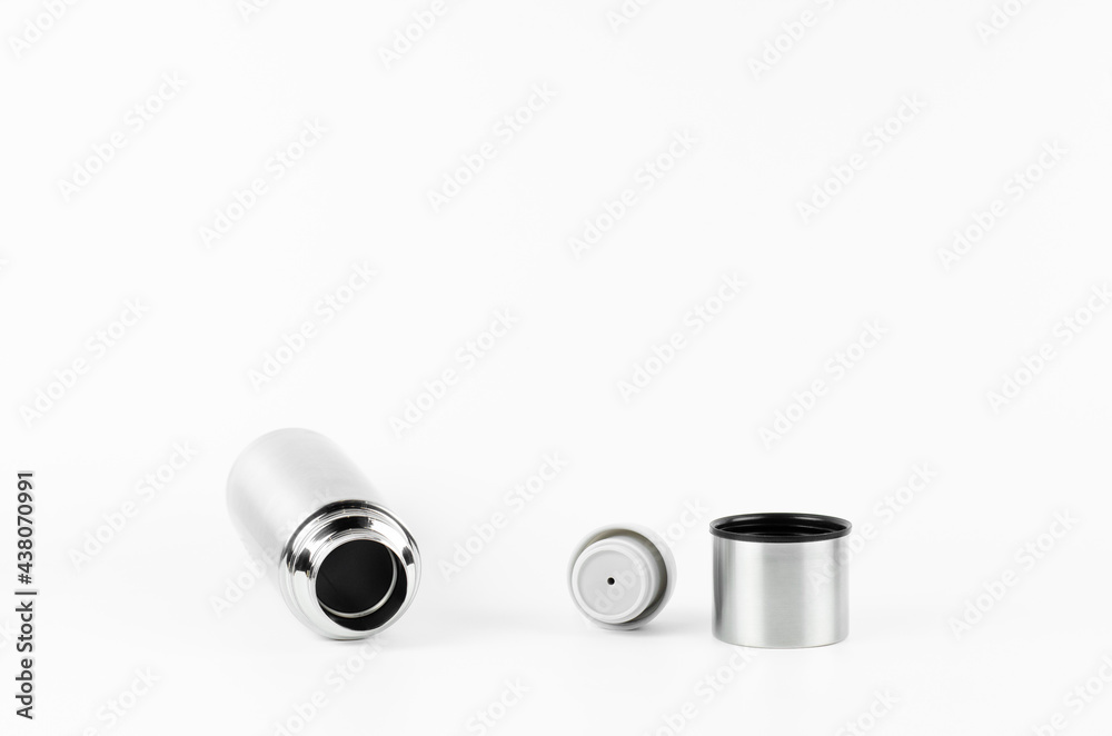 Metal thermos made of stainless steel. On white background. Thermos cup. Metal thermos made of stainless steel. On white background. Thermos cup.