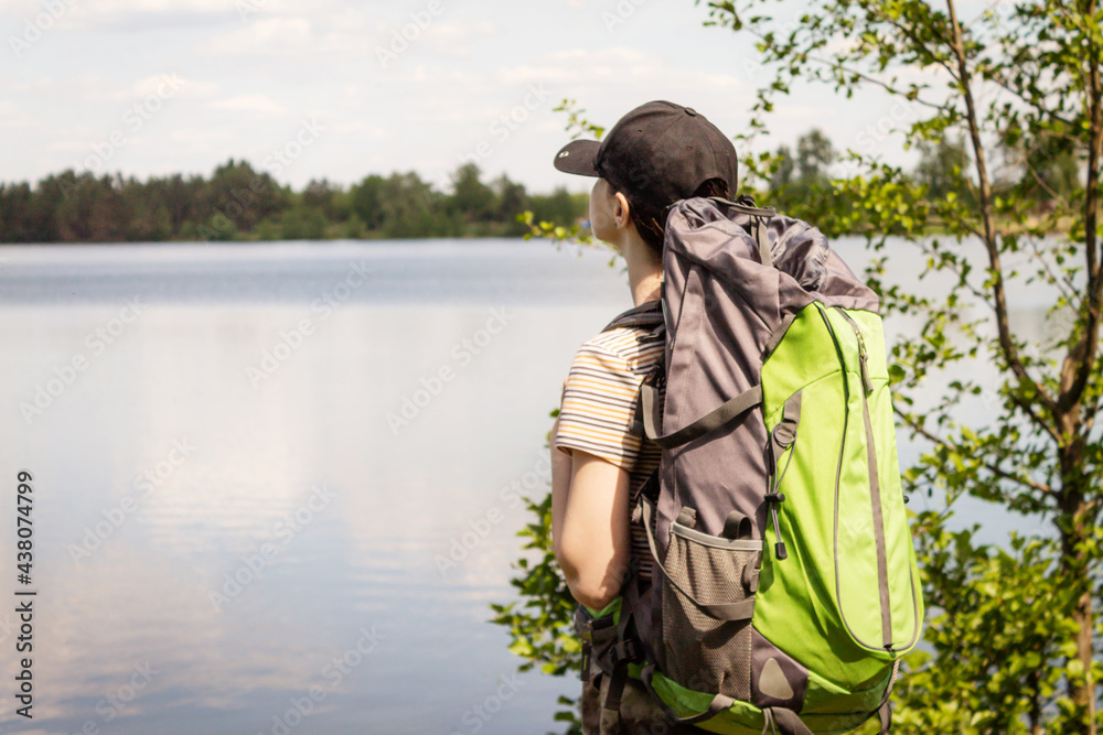 A young girl travels with a backpack. Enjoys the view. A young girl travels with a backpack. Enjoys the view.