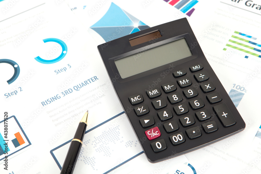 Calculator and pen on financial chart Calculator and pen on financial chart