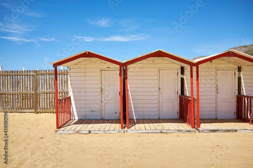 the wooden cabins mounted with colors for the opening of the summer season on the beach of Sicily © Z O N A B I A N C A