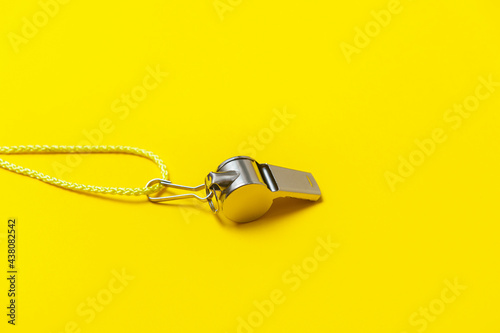 Konstfotografi Sports whistle on yellow background