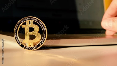Bitcoin business. Gold Crypto currency BTC Bitcoin on black background. Golden Bit Coin virtual cryptocurrency or blockchain technology. Virtual money and mining concept