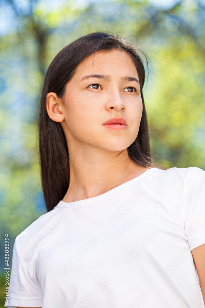Portrait of a young beautiful girl in summer park Portrait of a young beautiful girl in summer park