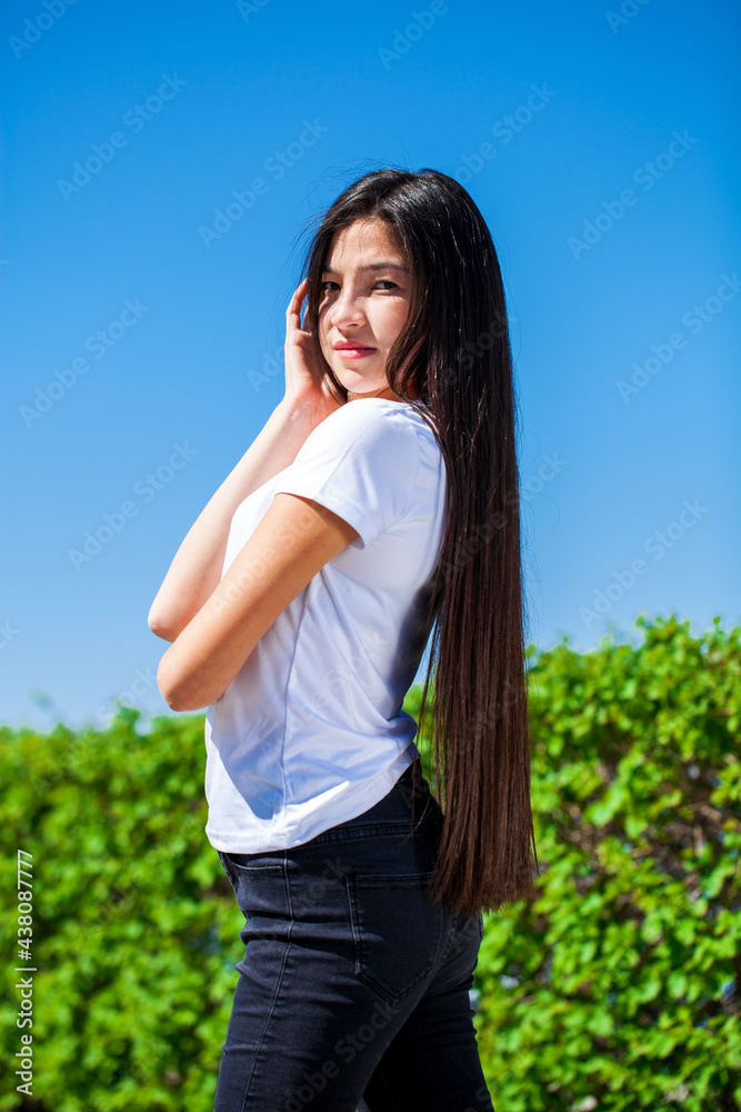 Portrait of a young beautiful girl in summer park Portrait of a young beautiful girl in summer park