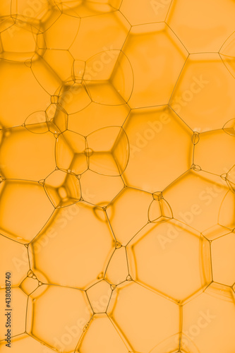 Abstract background with hexagons shape on soup bubble on golden backgrounds.