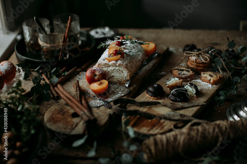 Decorated cake and cookies on wooden boards photo