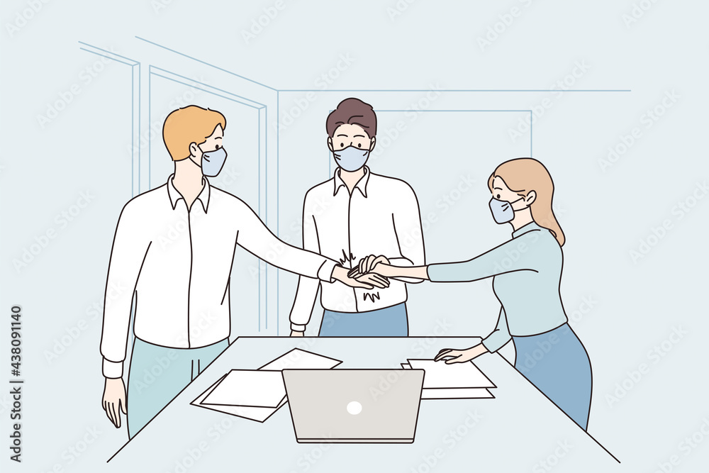 Fototapeta premium Success, cooperation, teamwork during covid-19 concept. Young business partners workers in face medical masks shaking hands meaning agreement in office during pandemic vector illustration 