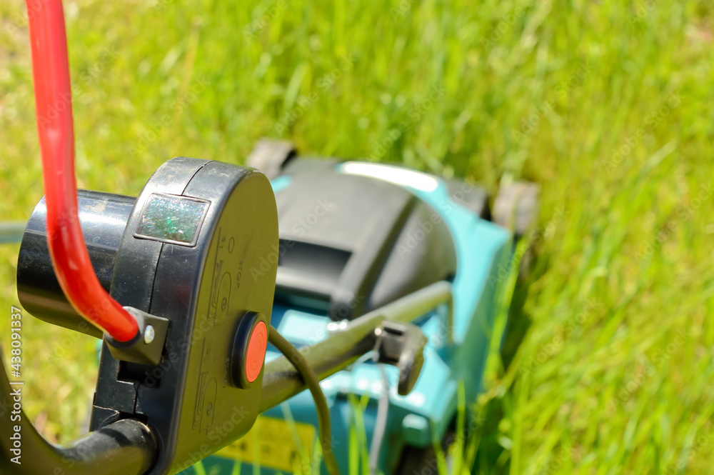 electric lawn mower handle with red power button electric lawn mower handle with red power button