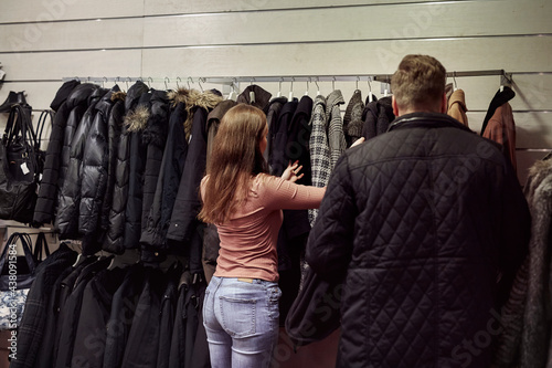 Young couple in clothes shop photo