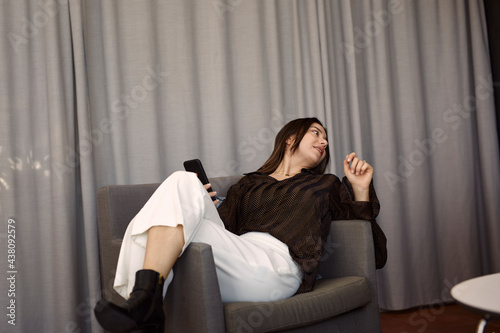 Businesswomen relaxing on armchair