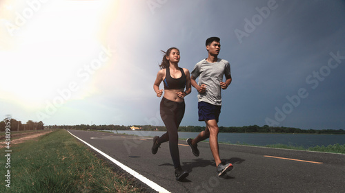 Strong runner being run go on the street, Young people running exercise on road.