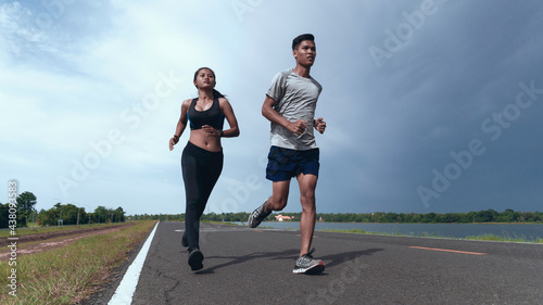 Strong runner being run go on the street, Young people running exercise on road.